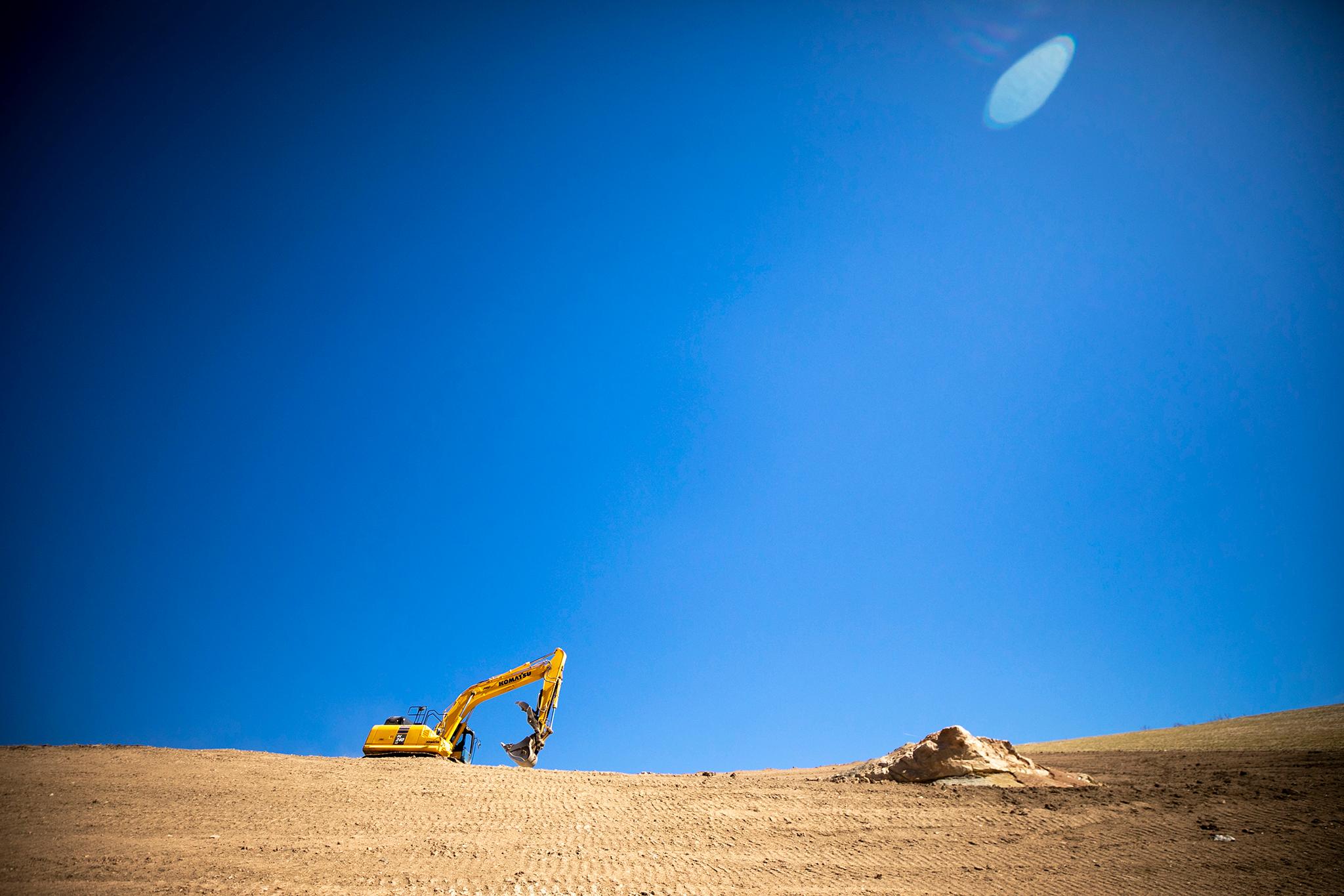 An earth mover atop a ridge at Colorado Springs' Pikeview Quarry. April 4, 2024.