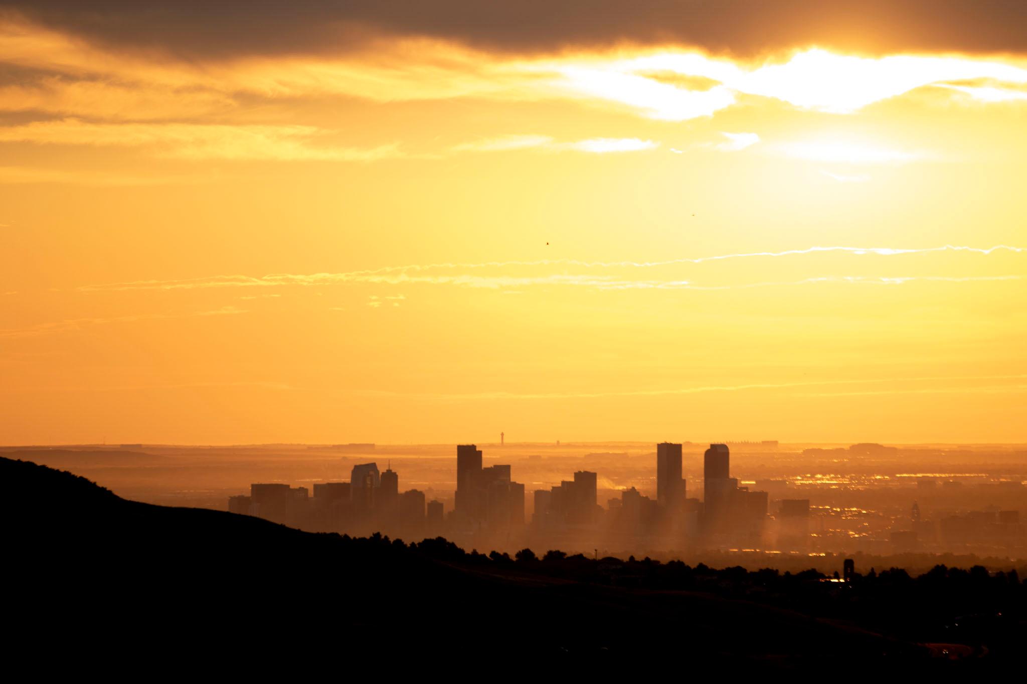 A hazy sunrise over Denver, seen from Red Rocks. July 27, 2024.