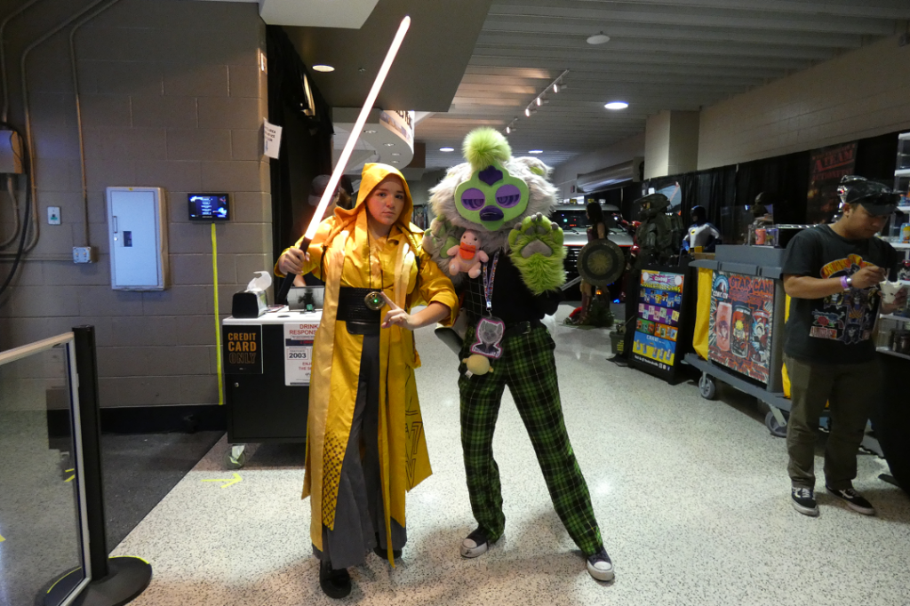 Two young women pose in costume.