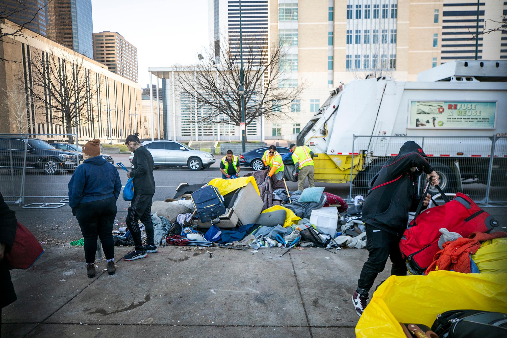 An encampment &quot;closure&quot; around 20th and Champa Streets downtown. Dec. 7, 2023.