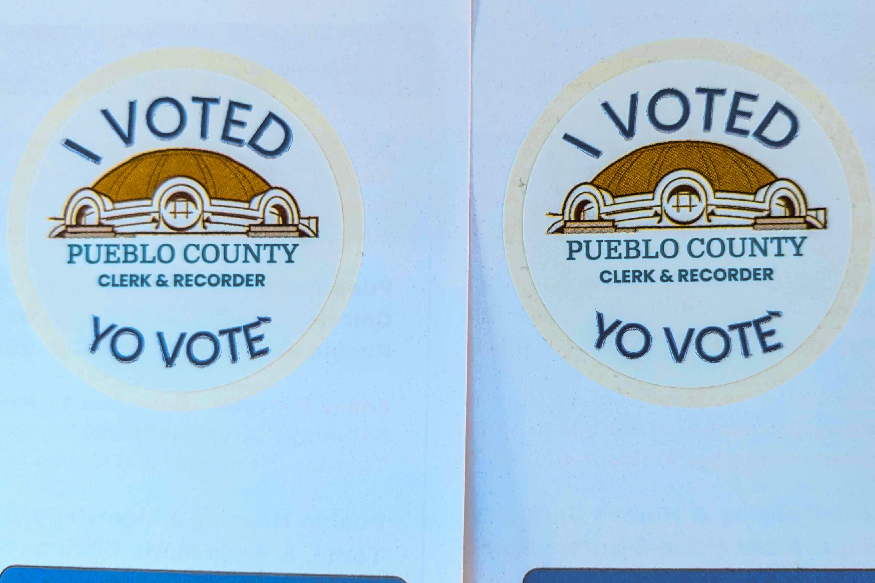 stickers that read I voted pueblo county clerk and recorder and yo vote with a graphic of the courthouse dome