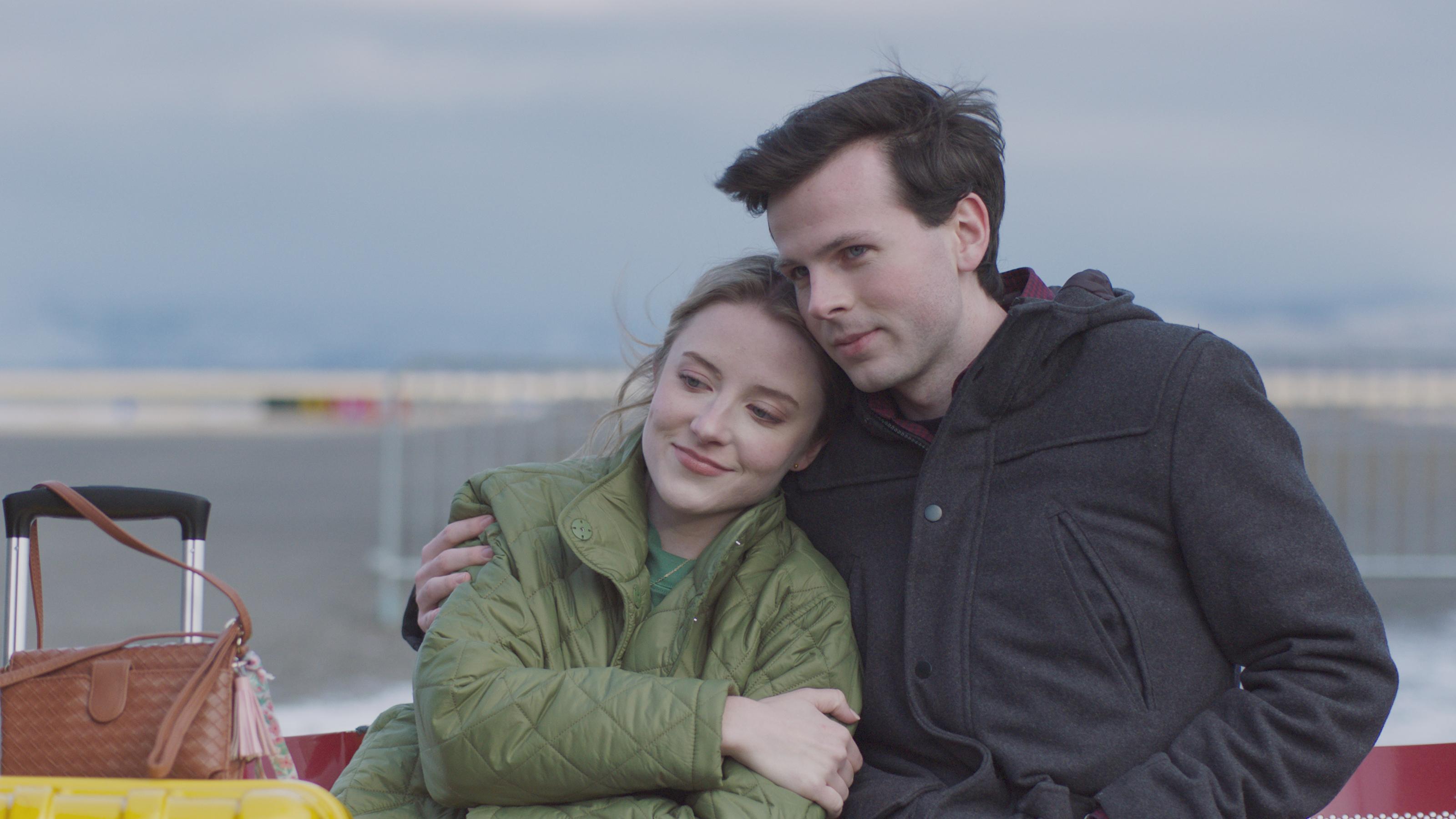 Couple embracing in film "Breakup Season"