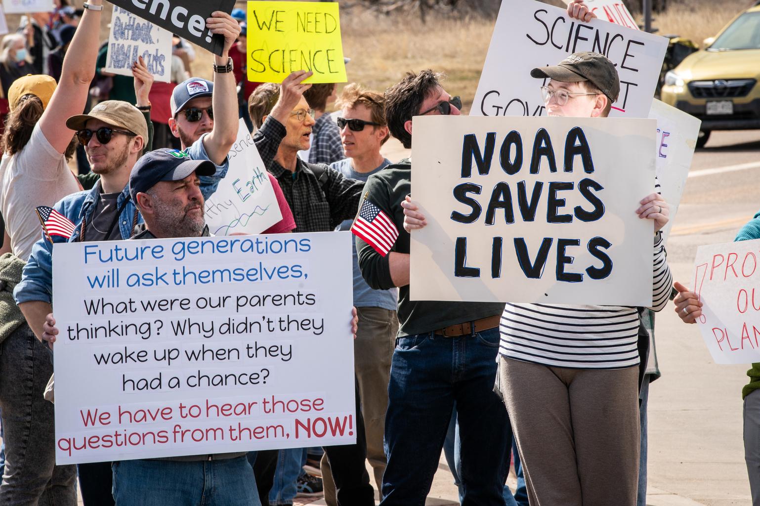 Hundreds protest outside the NOAA-NIST campus in Boulder Monday after the Trump administration’s firing of as many as 1,830 NOAA employees nationwide