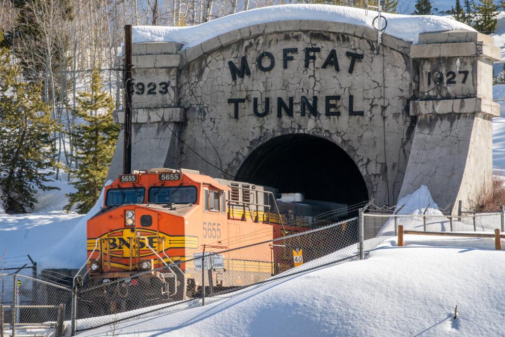 A BNSF freight rain passes into the Moffat Tunnel at Winter Park ski area