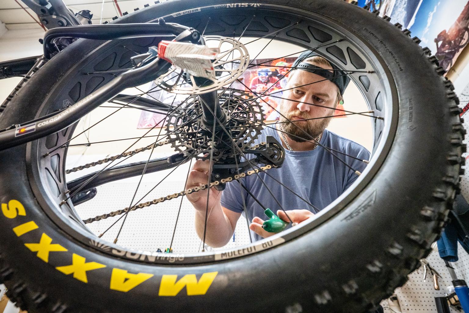 Dakota Mossbrook assembles a Borealis fat bike in the company’s shop in Colorado Springs