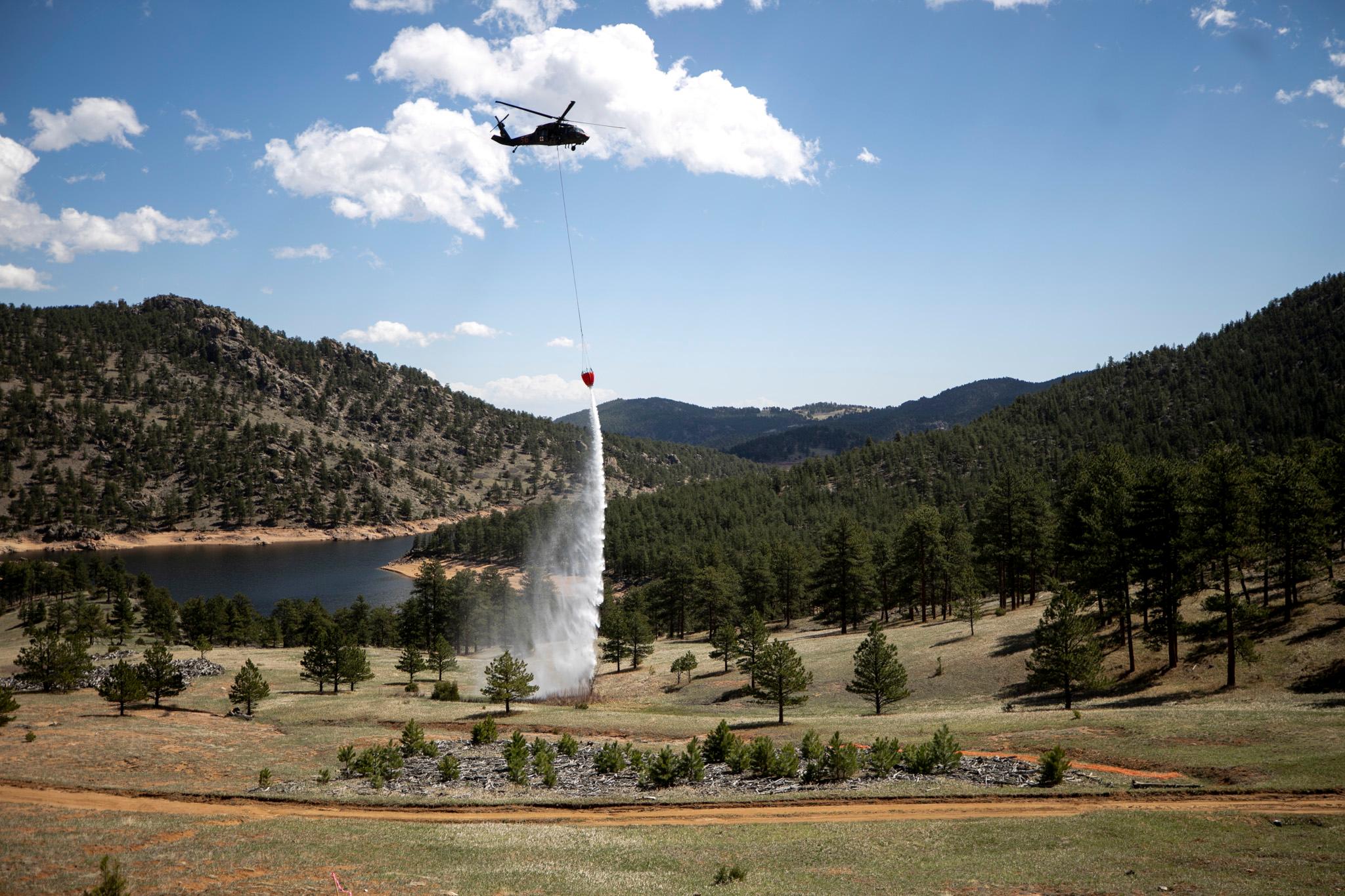 U.S. Army National Guard members drop water on targets