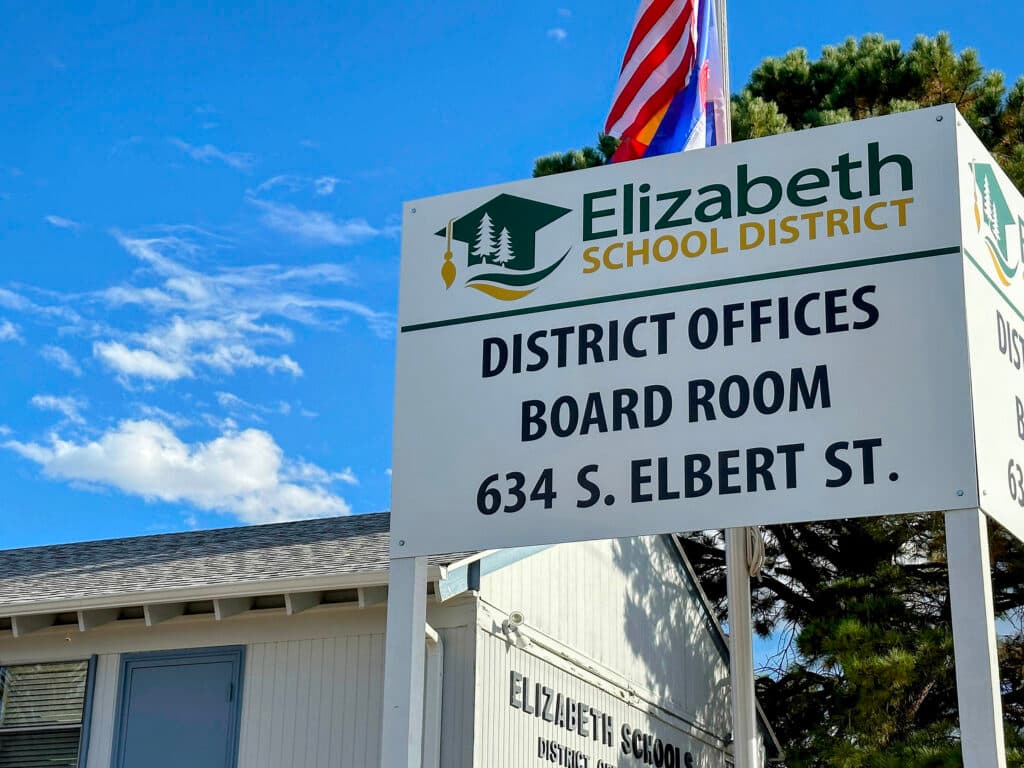 A sign about a school district.