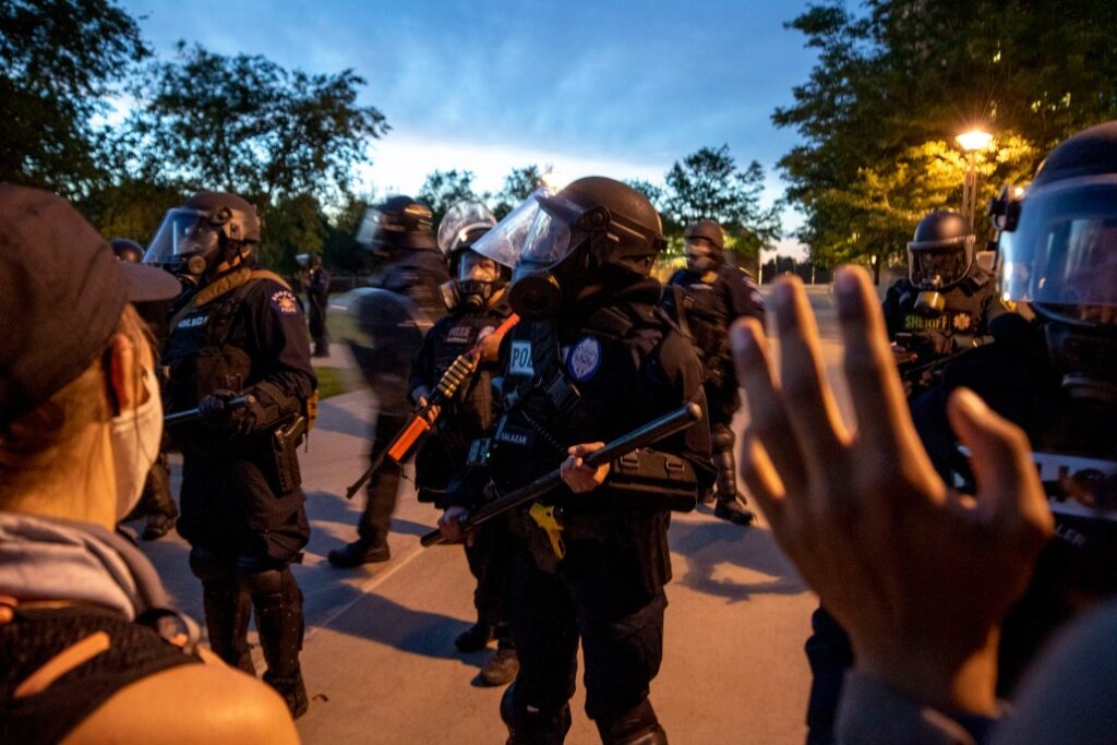 Aurora Police officers in riot gear at a protest
