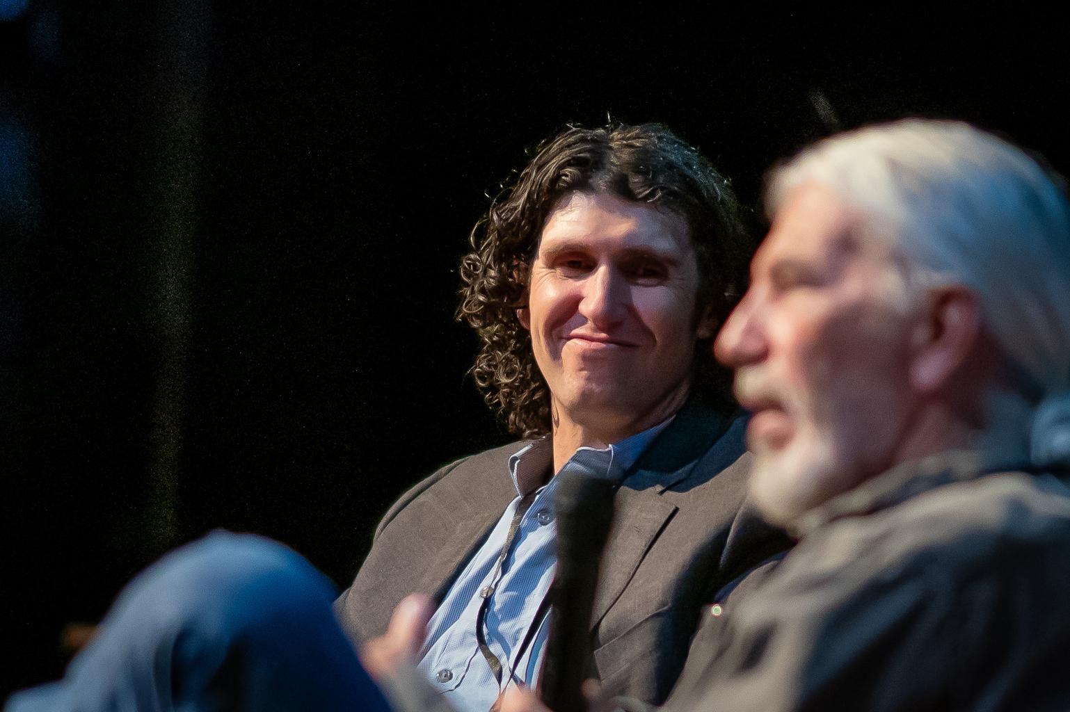 Colorado journalist and author Ben Goldfarb, left, speaks with fellow environmental writer Dan Flores