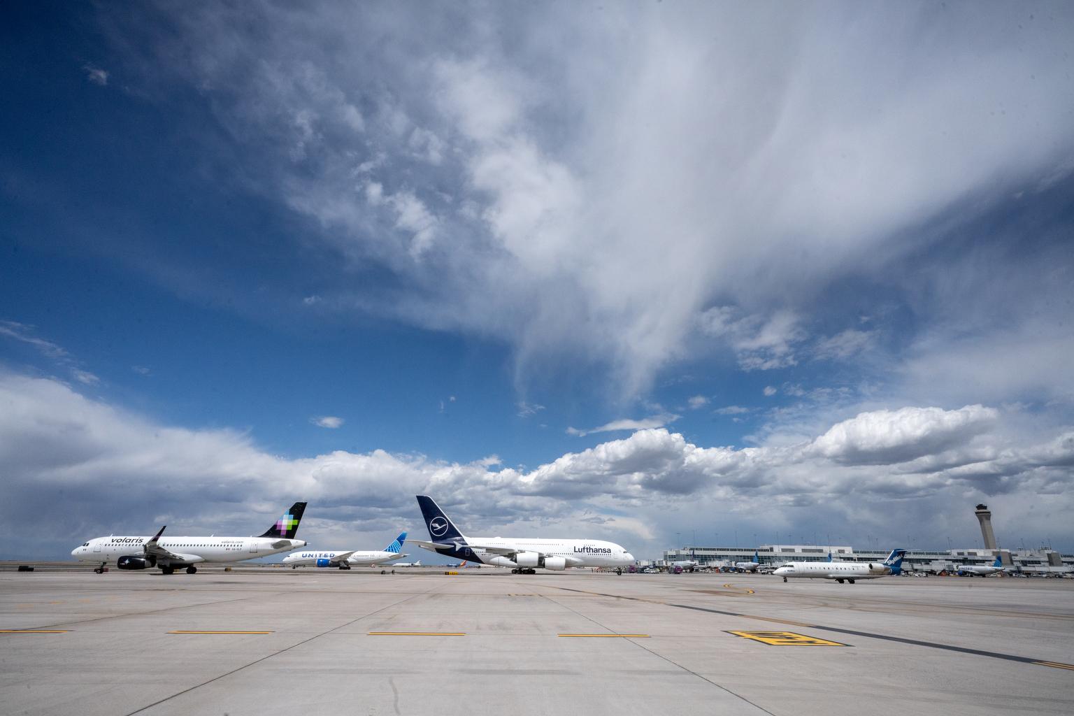 Numerous airliners taxi to either to a runway for a gate at Denver International Airport