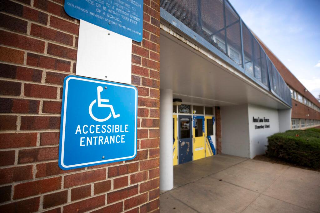 An accessible entrance sign at Force Elementary School