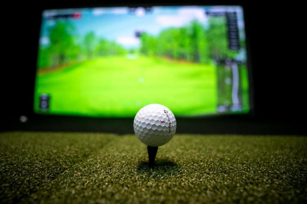 A ball on a tee inside Wheat Ridge's COR-Golf. May 28, 2025.