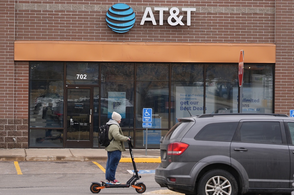 AT&T company logo hangs over the door
