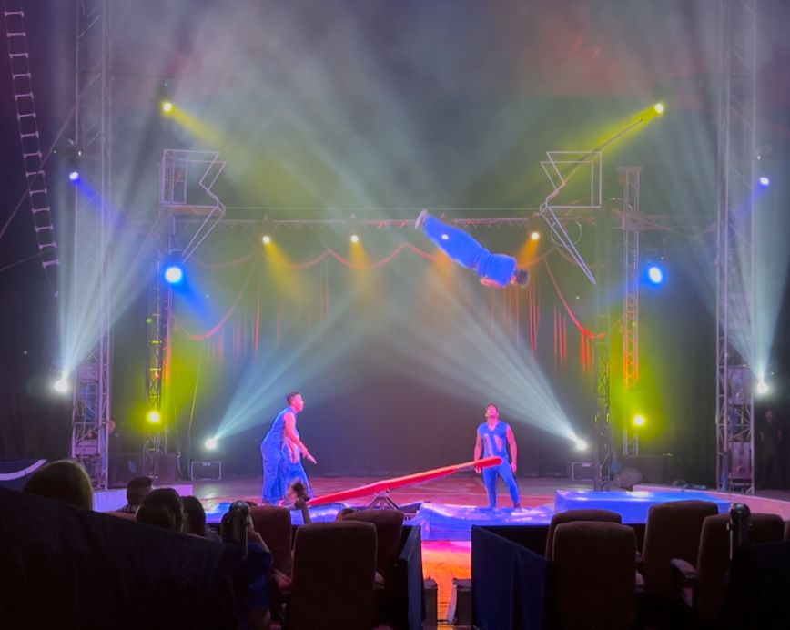 Man flying in air after jumping from seesaw