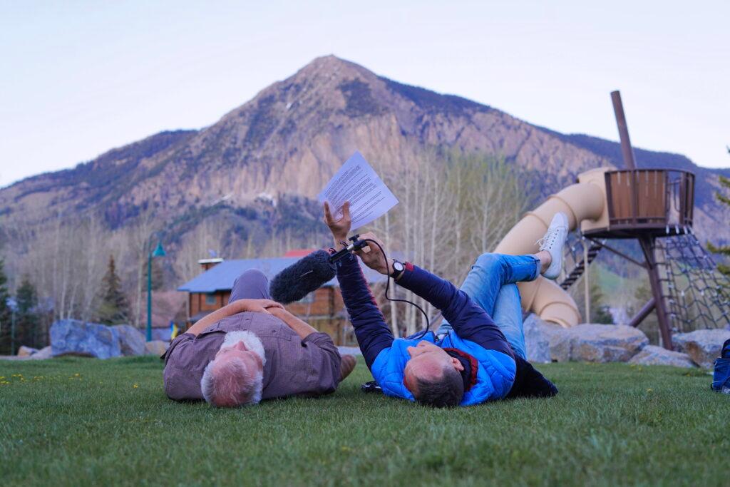 Two people laying on the ground