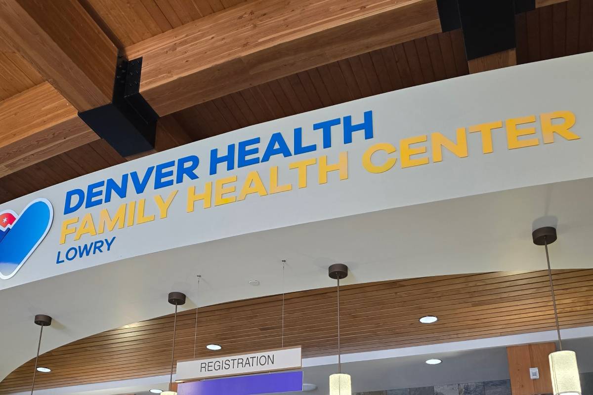 A sign reading "Denver Health Family Health Center Lowry"