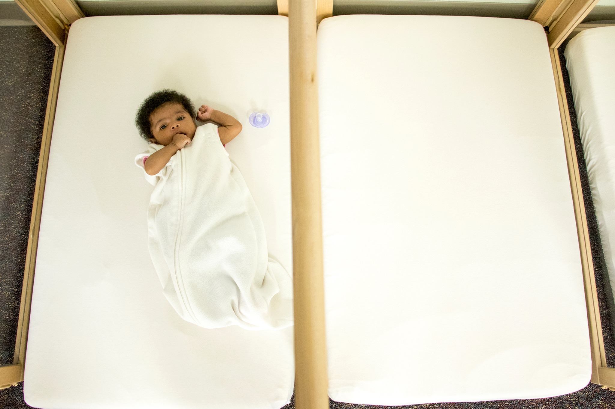 A baby on a mat