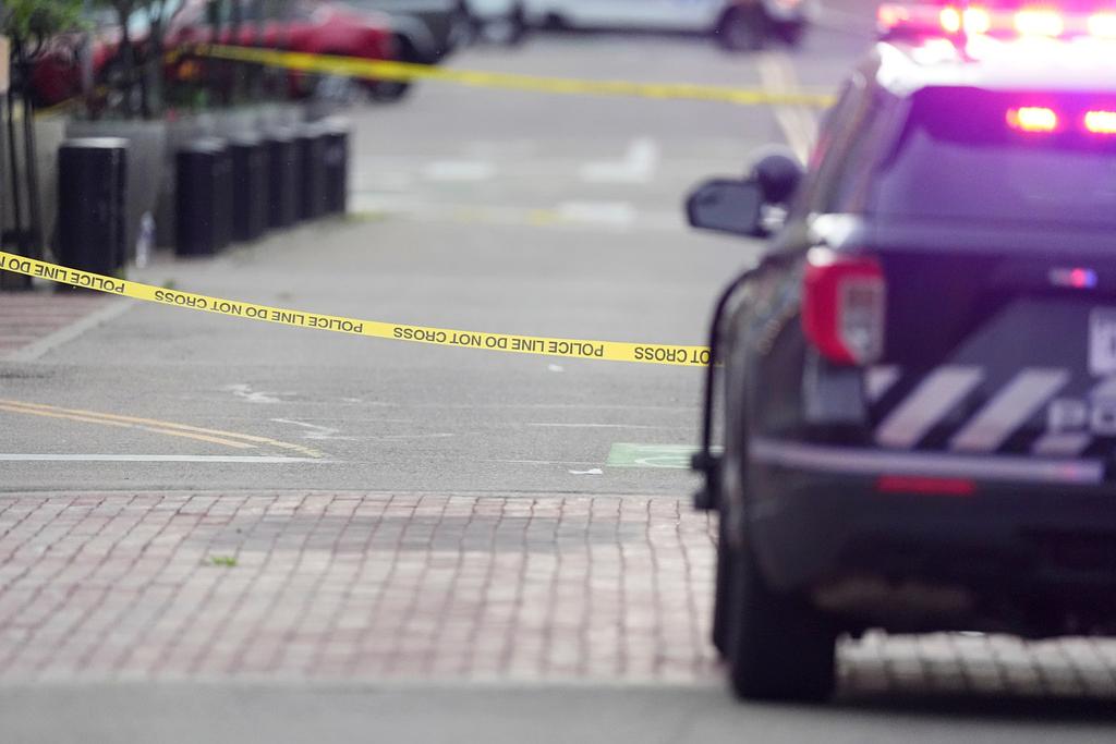 A police car behind police tape