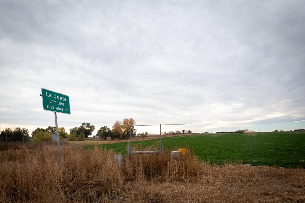 city limits sign near agricultural area