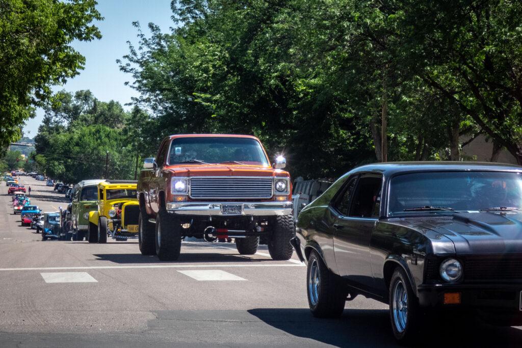 parade of street rod cars and trucks