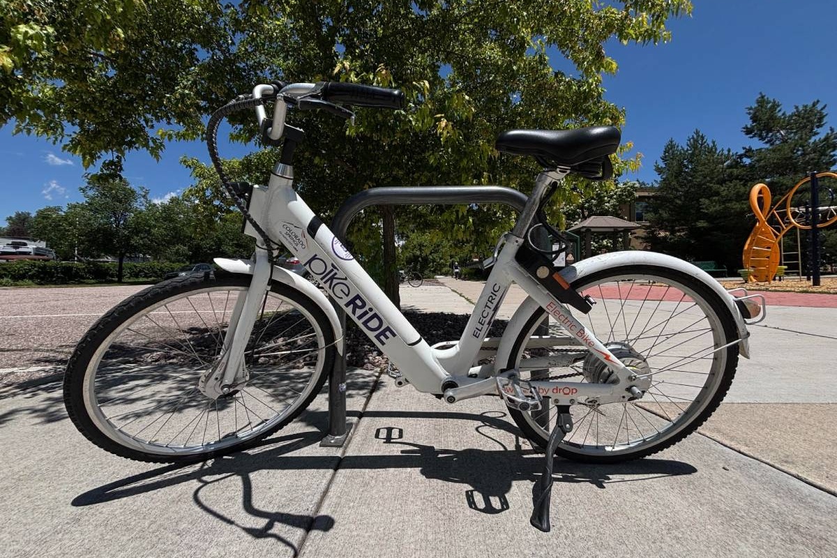 White and black PikeRide Bike parked outside in Colorado Springs