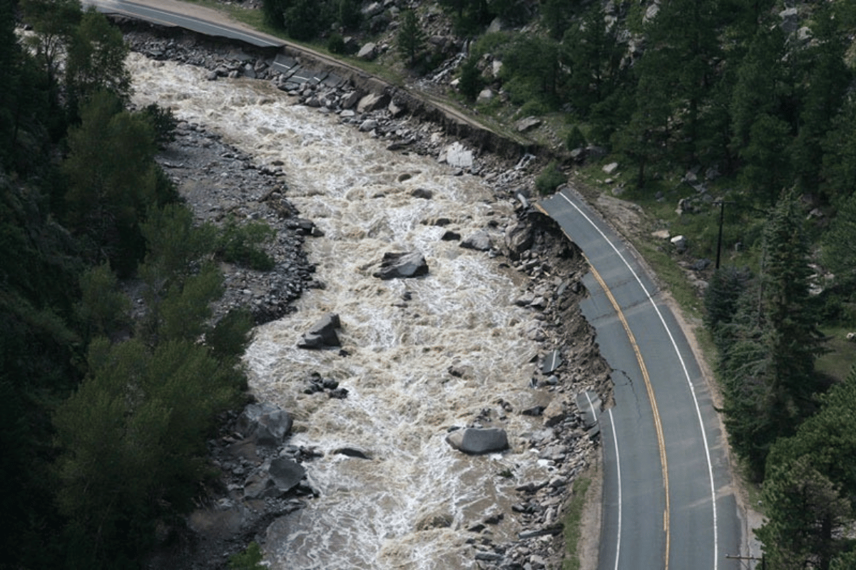 a road flooded and damaged