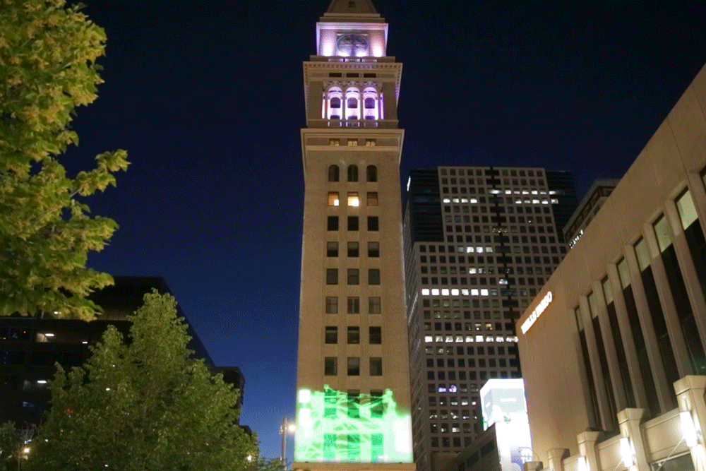 A green zap travels up the clocktower, turning white and zapping all over before receeding back to the bottom of the clock tower, where it starts all over again.