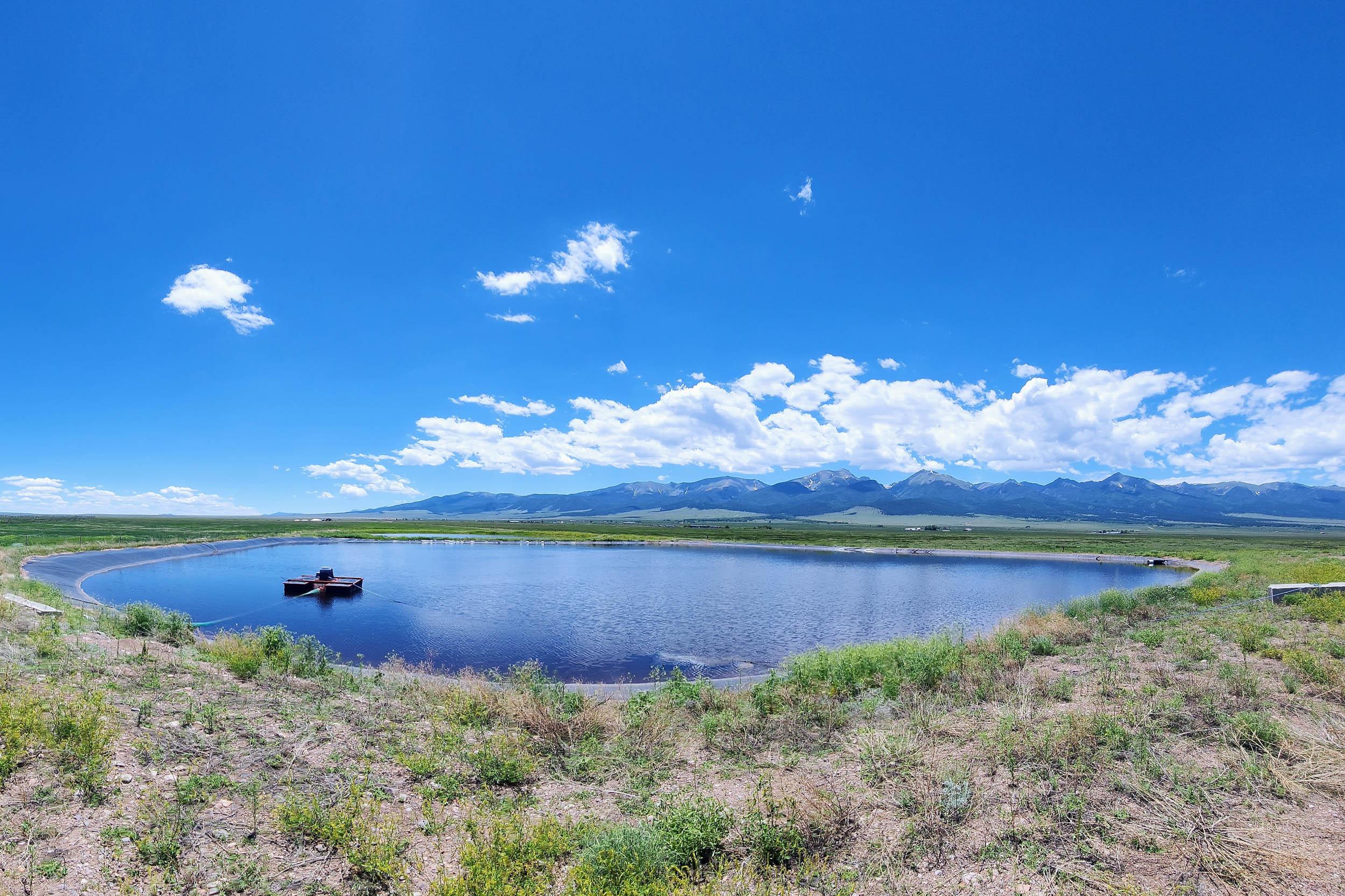 a pond in a mountain valley
