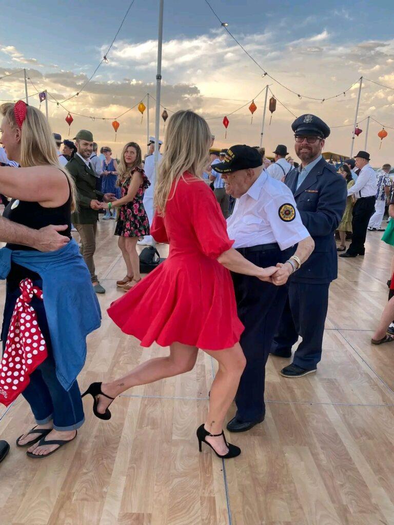 Howard Berger. 101, dances at a military ball
