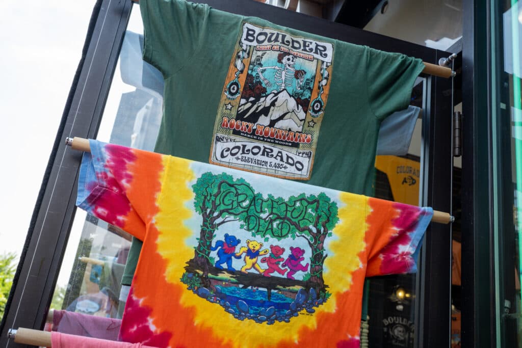 Grateful Dead-themed t-shirts adorn the door of a souvenir shop on Pearl Street in Boulder