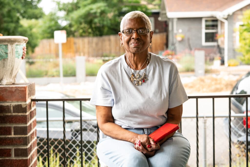 Mercedes Toregano poses for a photo on her front porch