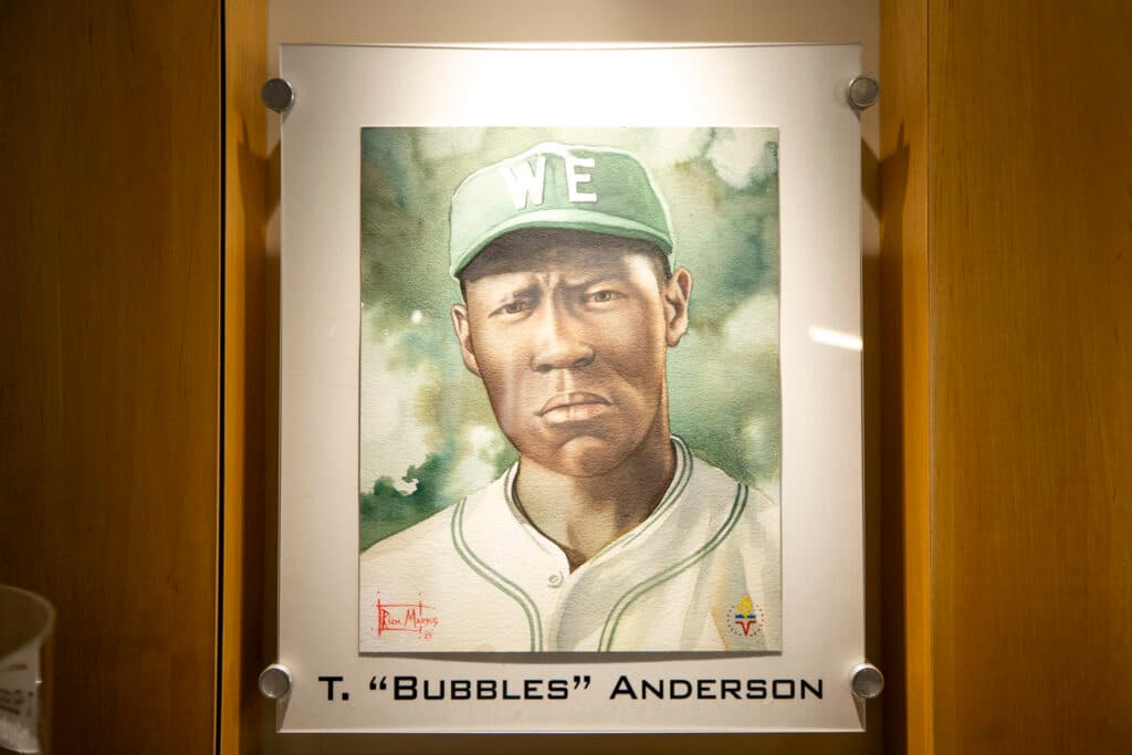 A framed portrait of baseball player Theodore "Bubbles" Anderson. He is wearing a green baseball cap and a baseball uniform. It is a head-and-shoulders image.