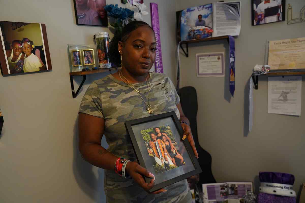 A woman holds a photo