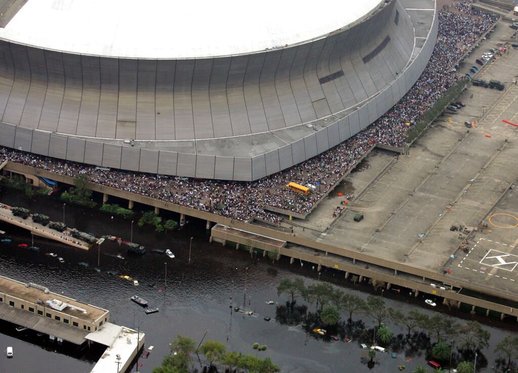 aerial view of the superdome in New Orleans as people gather outside
