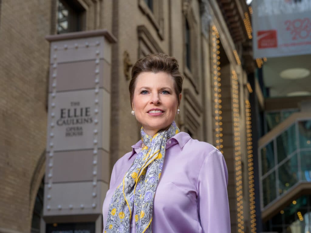 Barbara Lynne Jamison poses for a headshot in front of the Ellie Caulkins Opera House.