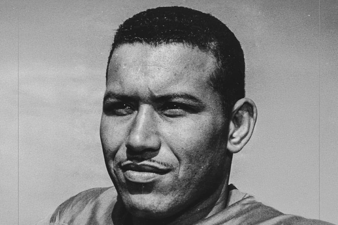 Black and white image shows the face of original Broncos player Lionel Taylor
