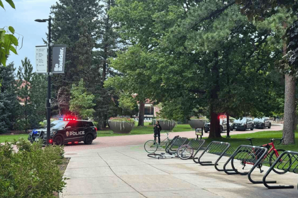 CU campus with police vehicles