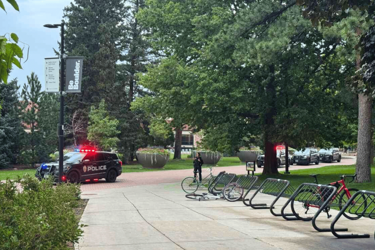 CU campus with police vehicles