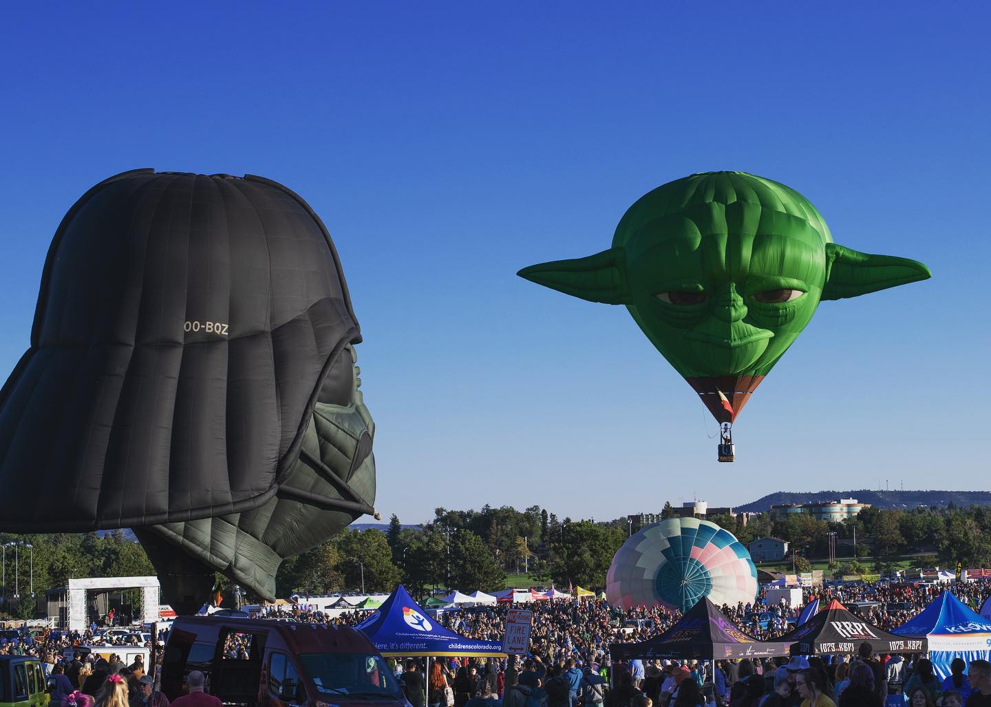 Yoda and darth vader hot air balloons in the sky