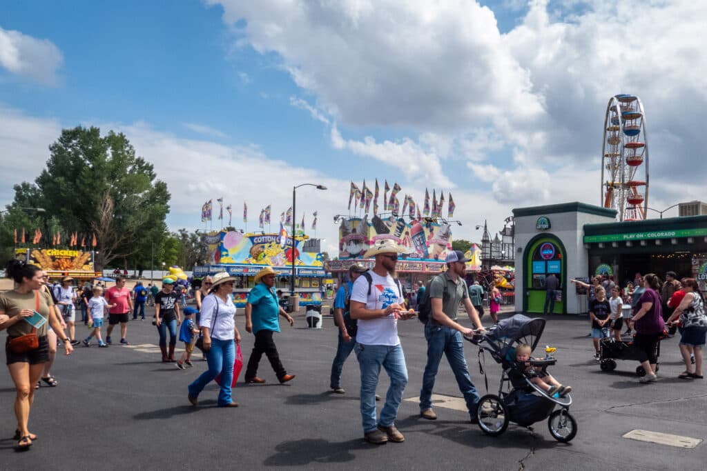 people waking near a carnival