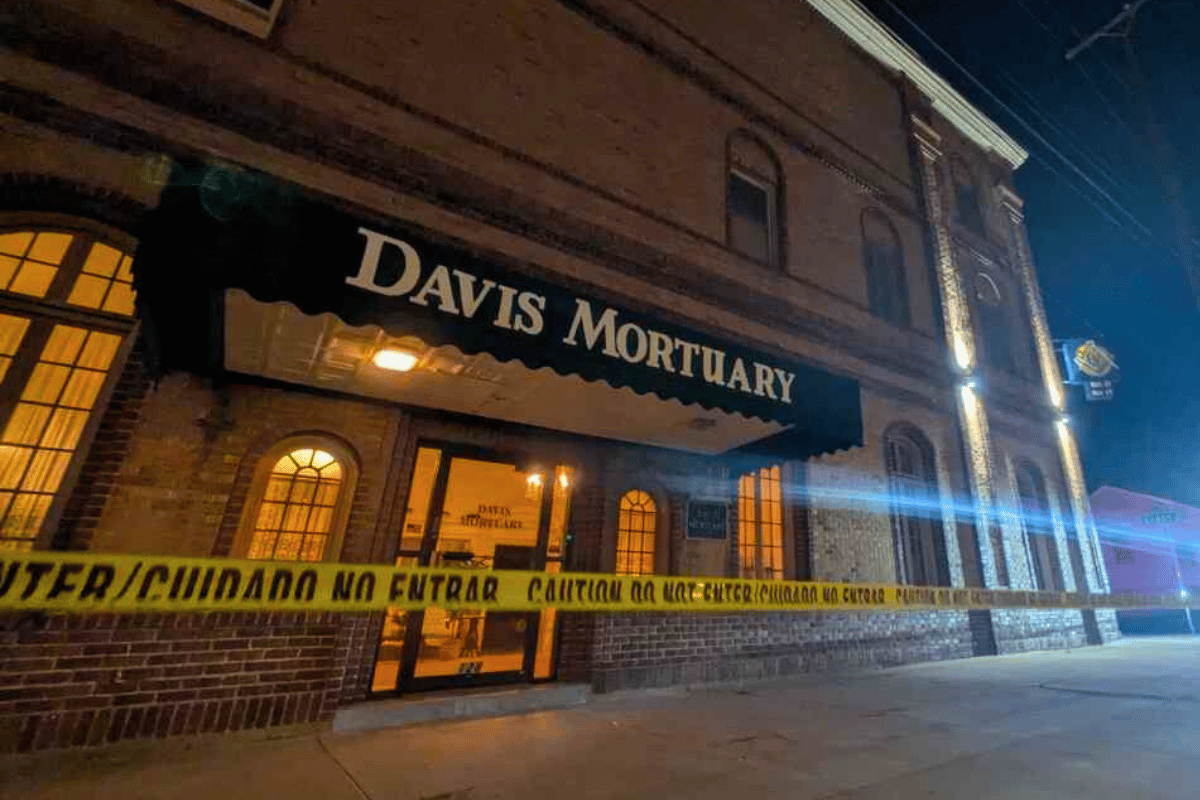 brick building with police tape around it