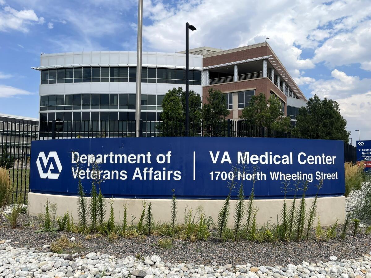 VA Medical center sign in front of buildings.