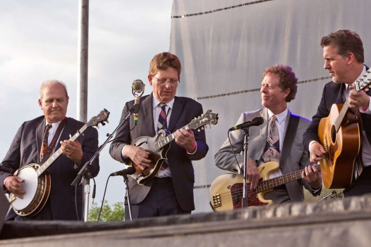 The members of Hot Rize play an outdoor stage together.
