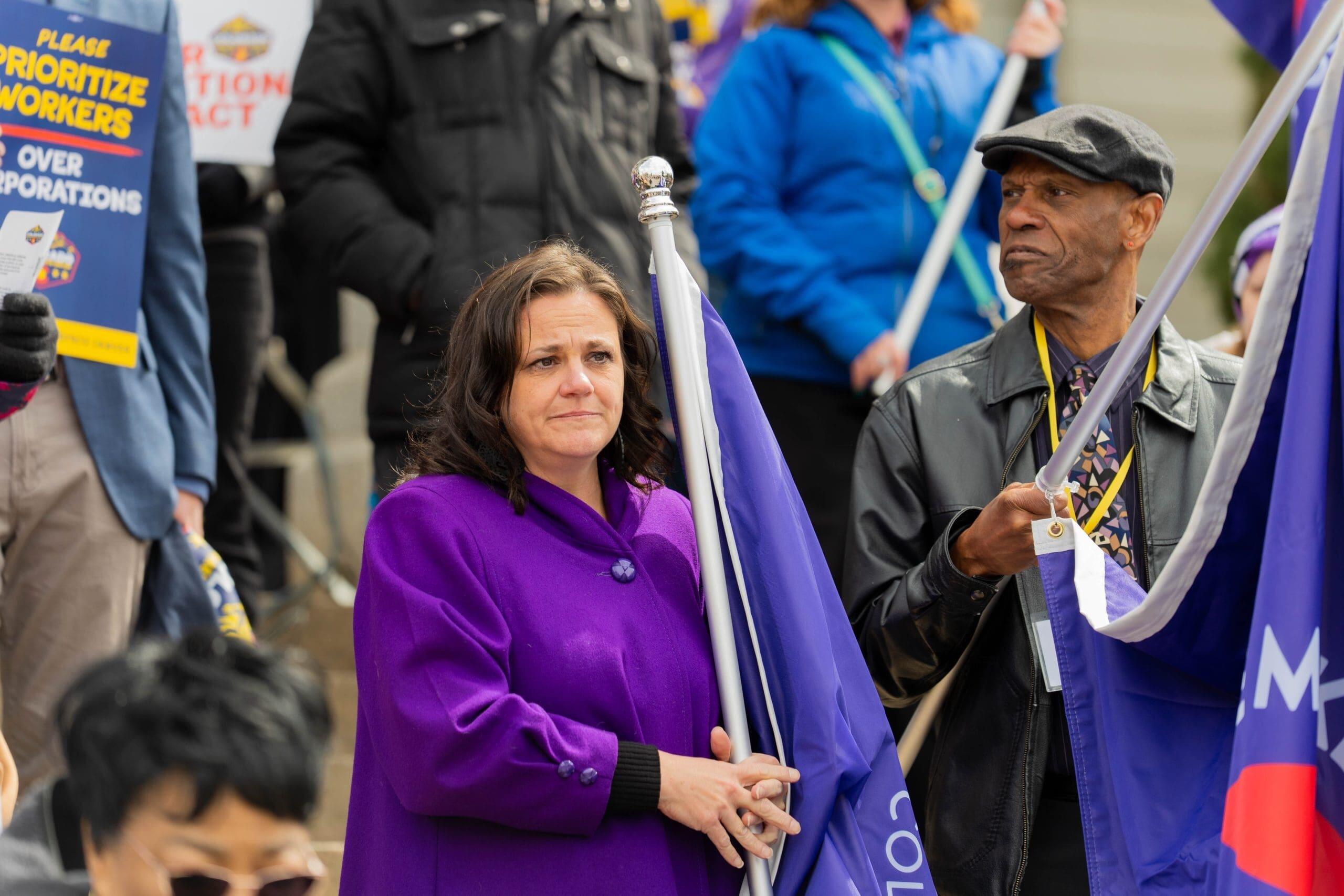 Hilary Glasgow, executive director of Colorado WINS, the state employees union, attends a pro-labor rally on the west steps of the Colorado Capitol on March 19, 2025.