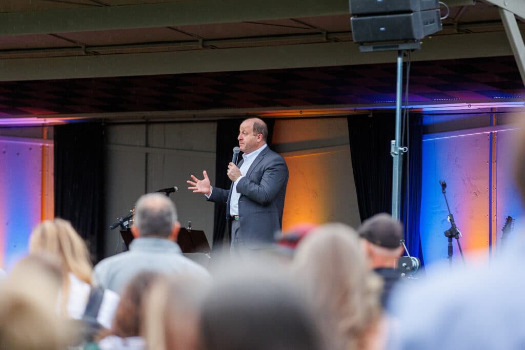Colorado Governor Jared Polis speaks at a vigil