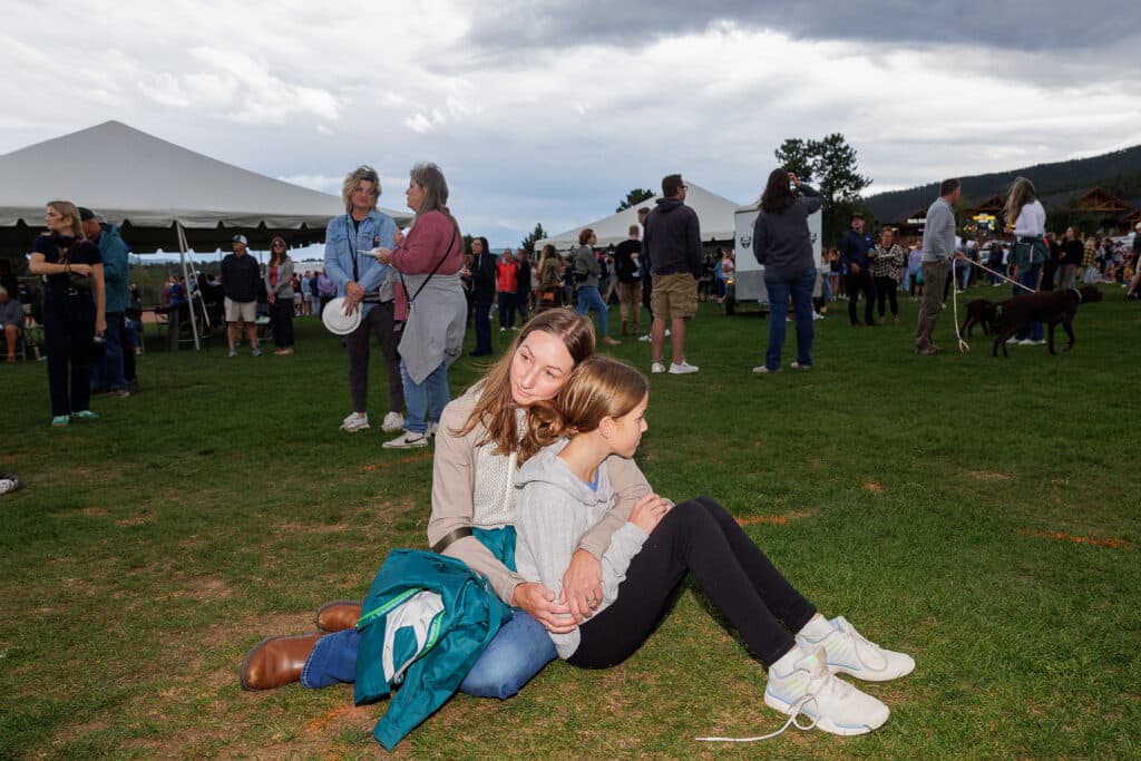 Amanda Grout holds her daughter Maerin at a vigil