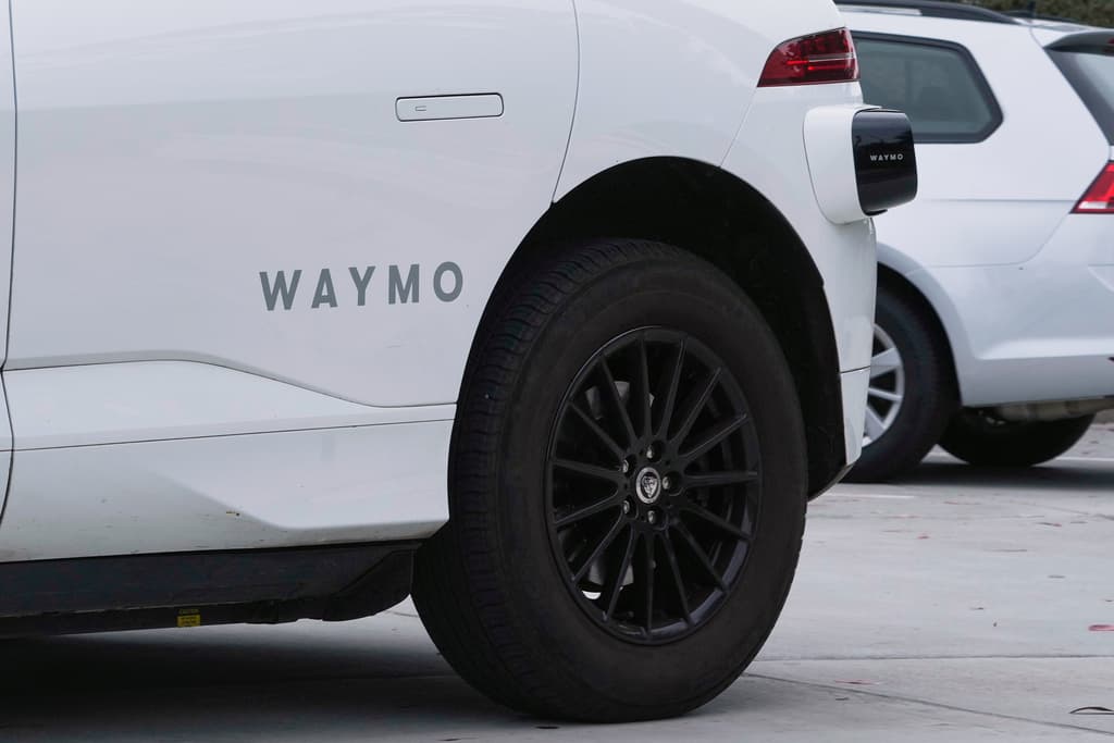 A white Waymo vehicle