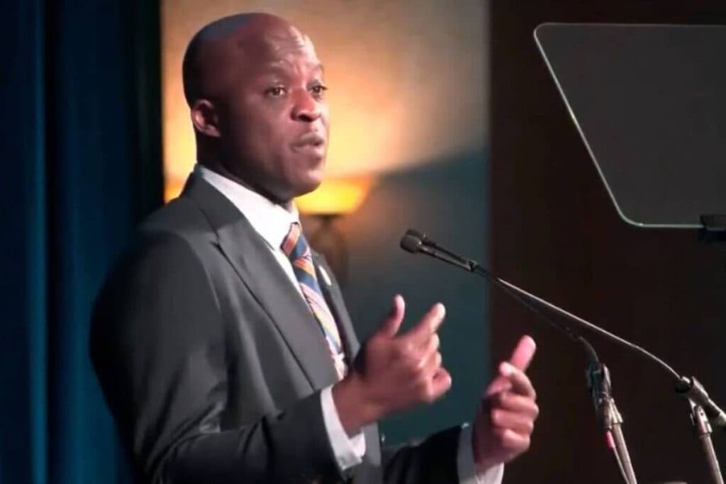 A man speaks at a podium