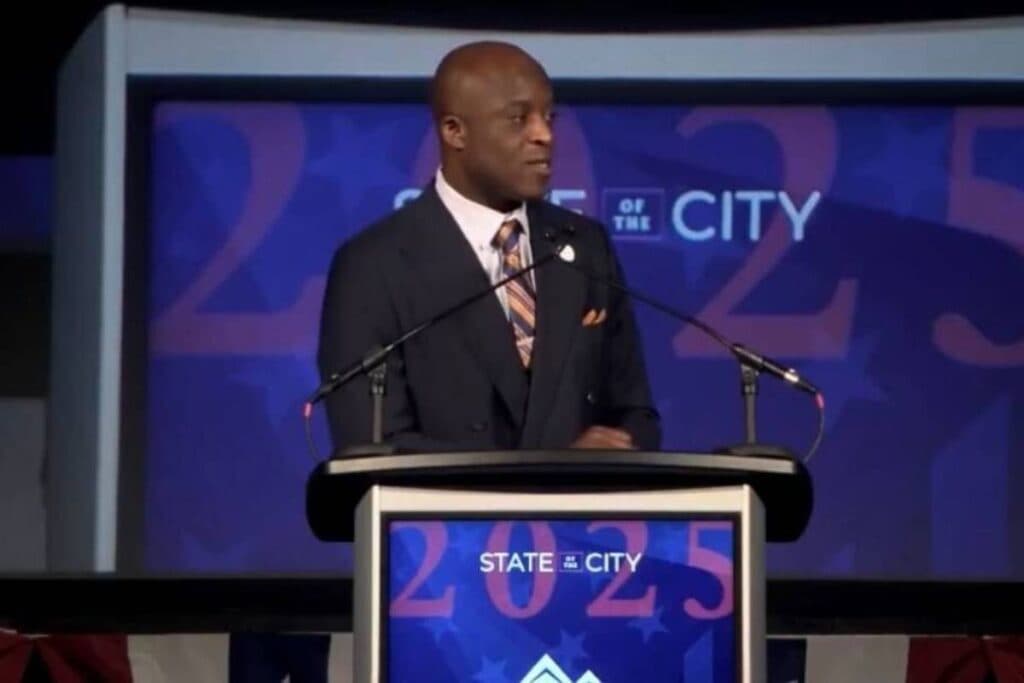 A man speaks at a podium