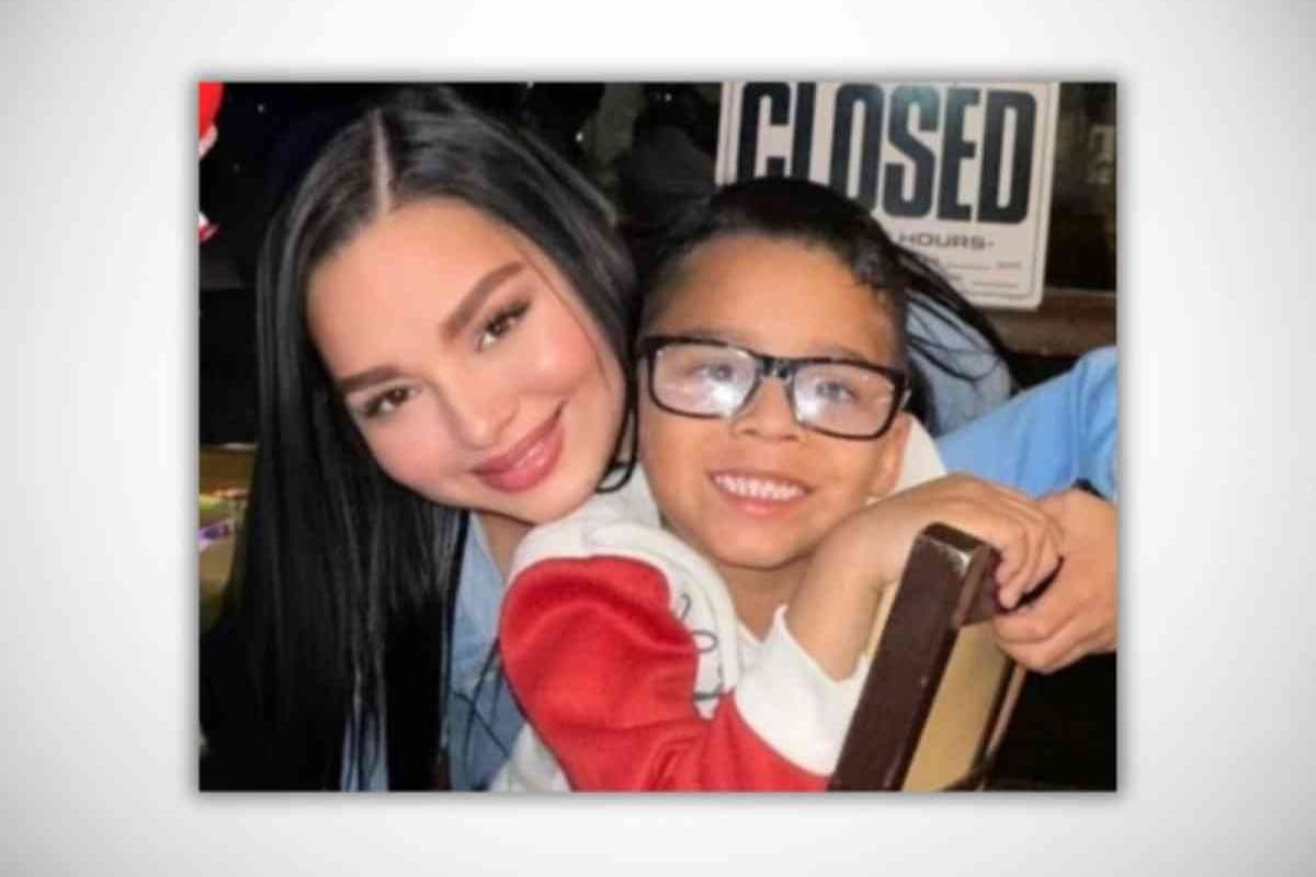 a woman and child smiling at the camera